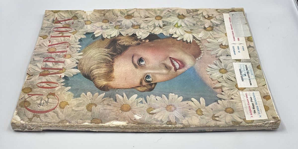 Side view of Woman’s Home Companion Magazine April 1951 with a stunning floral design around the cover image, highlighting the era's magazine aesthetics.