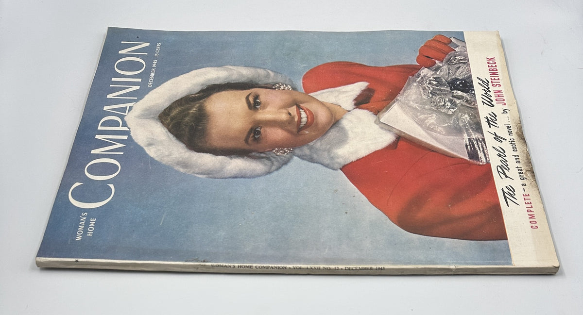 Cover of Woman’s Home Companion Magazine December 1945 featuring a woman in a red coat and white fur collar, showcasing John Steinbeck's short novel 'The Pearl of the World'.