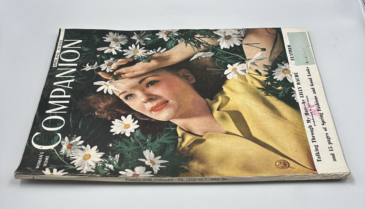 Cover of Woman’s Home Companion Magazine April 1946 featuring a model with a stylish hairdo among daisies, promoting Lily Daché Spring Fashions.