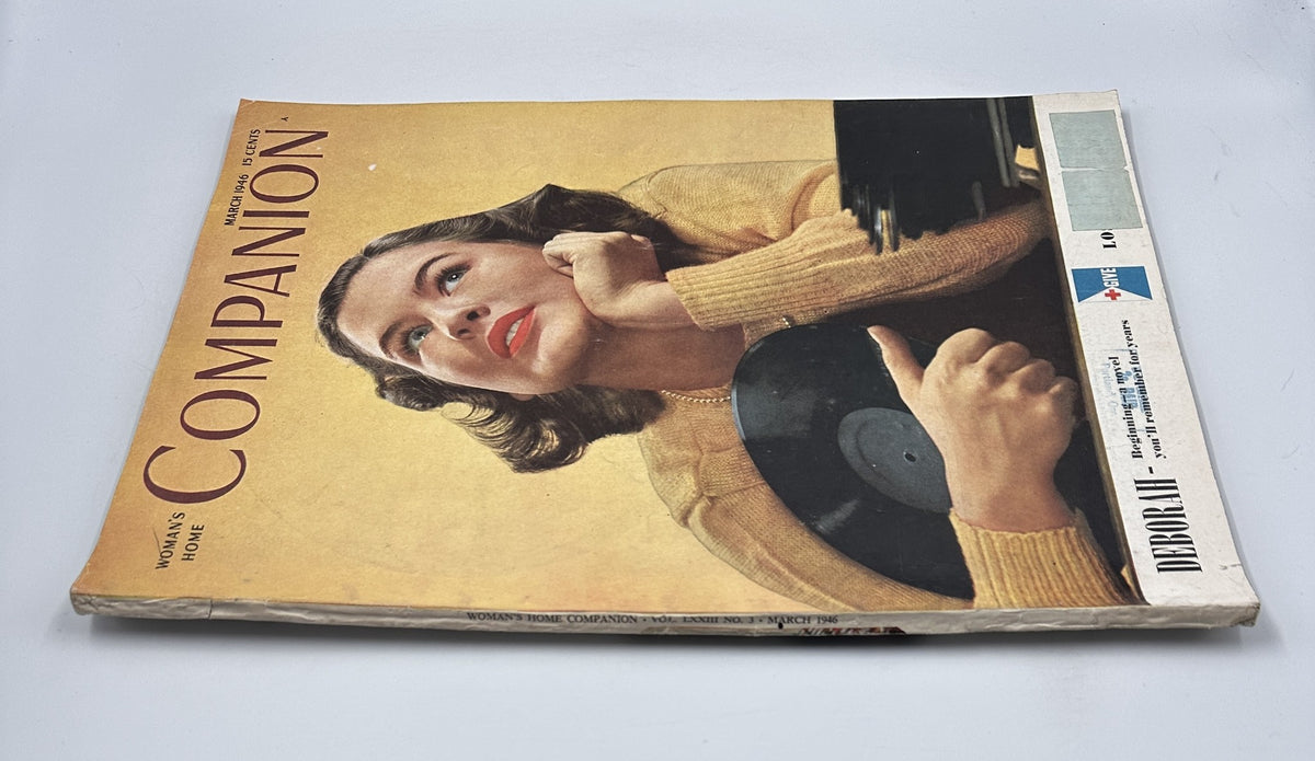 Vintage Woman’s Home Companion Magazine March 1946 cover featuring model Jackie McMillan, dressed in a stylish yellow sweater and holding a record. The issue is titled 'Deborah' and reflects mid-century fashion.