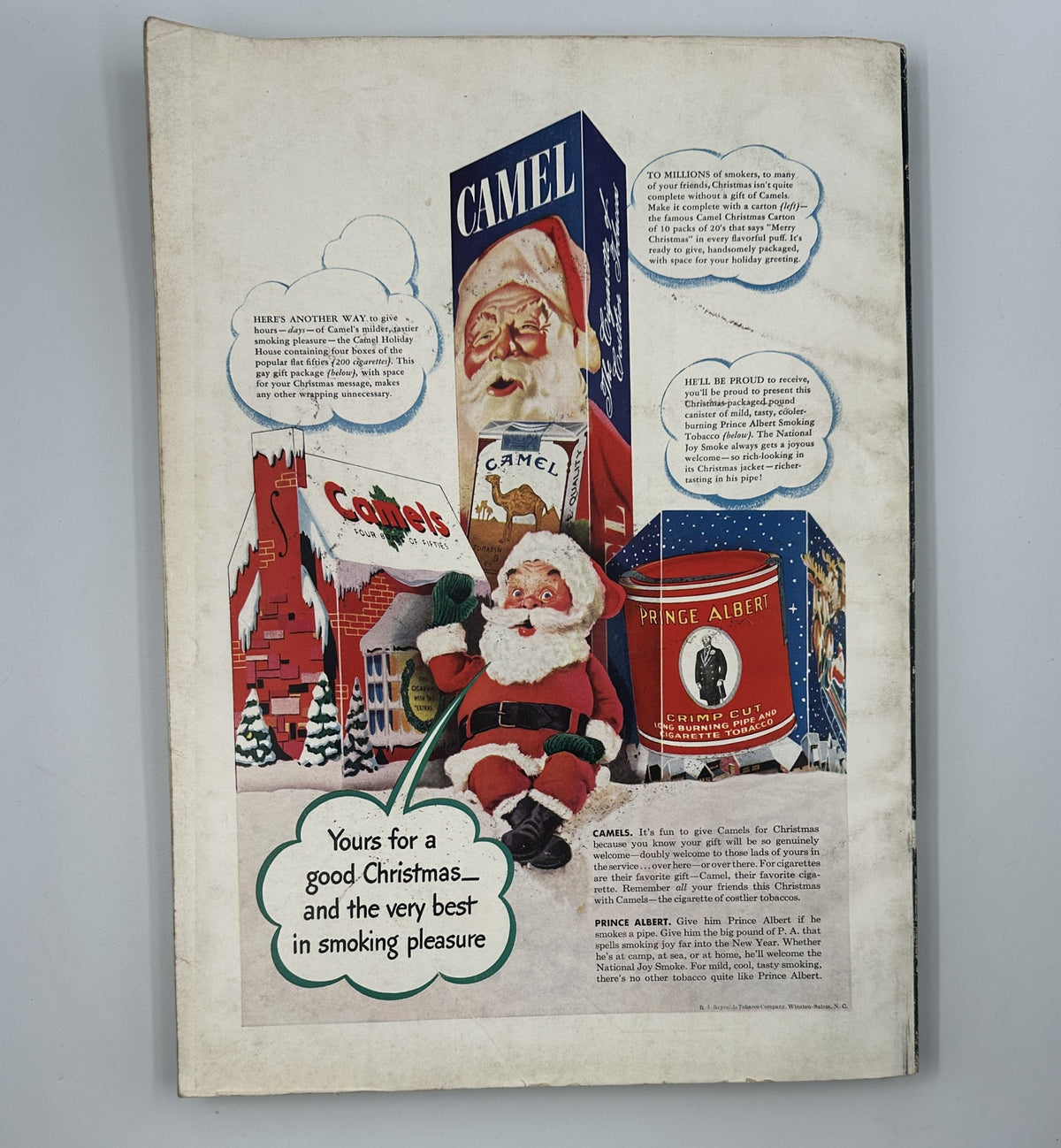 December 1942 Esquire Magazine advertisement featuring a Santa Claus with holiday products, promoting Camel cigarettes and celebrating Christmas in a nostalgic wartime context.