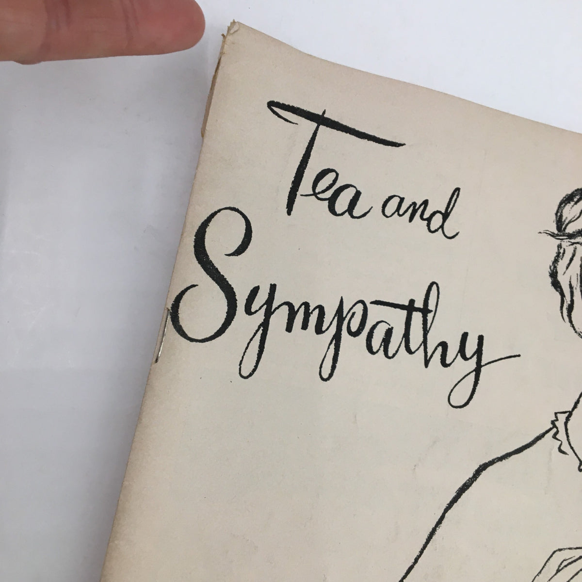 Close-up of the 'Tea and Sympathy' Playbill title from 1953, showcasing elegant typography and an illustration, highlighting Deborah Kerr's performance.