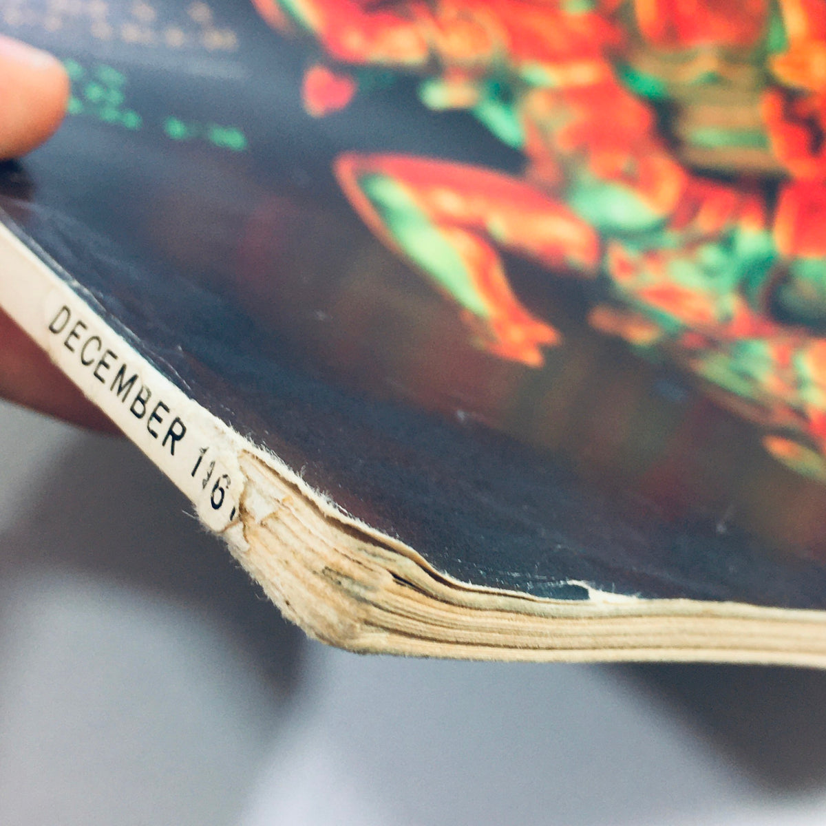 Detailed shot of the spine of the VTG HiFi Stereo Review Magazine December 1961, showing the publication date and unique colorful graphics from the vintage era.