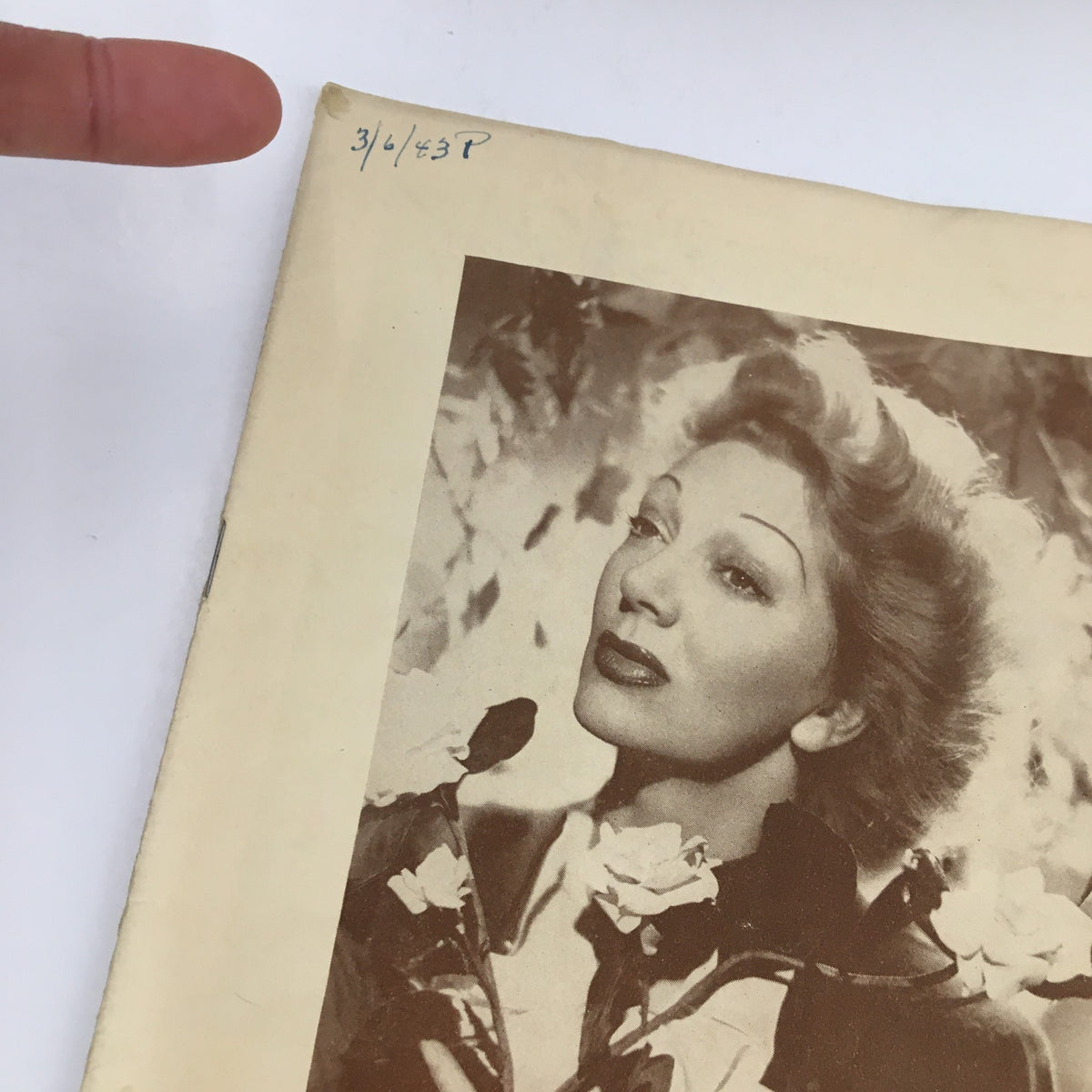Close-up of the 1943 Playbill for 'Lady In The Dark' at The Broadway Theatre, featuring a vintage photograph and the date '3/6/43' written on the cover.