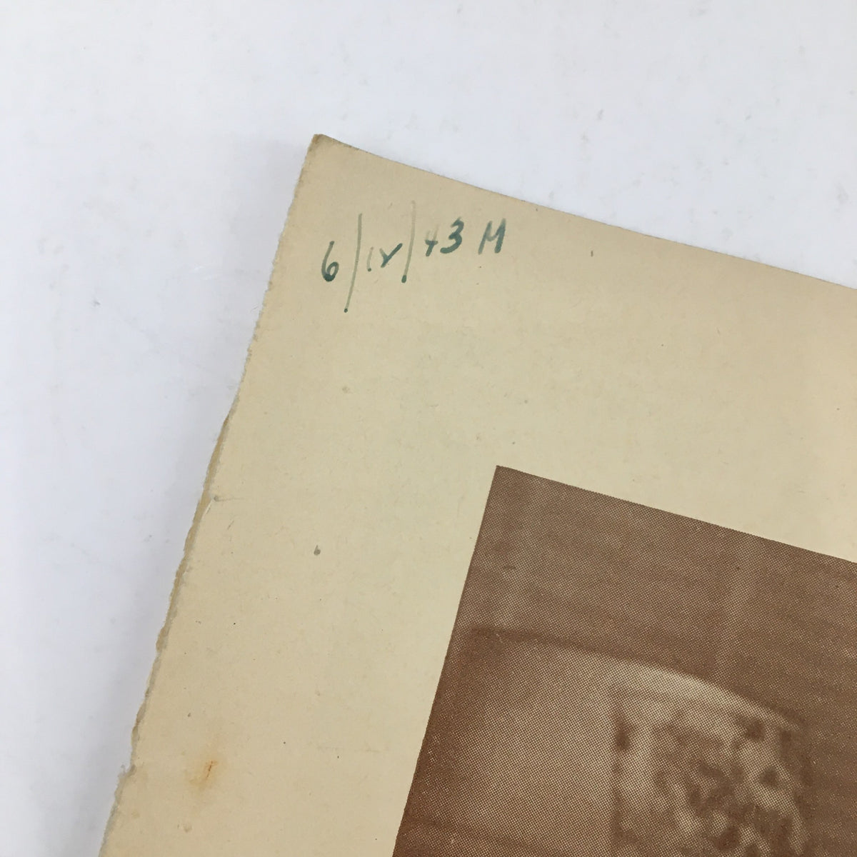 Top edge of the 1943 Playbill for Tomorrow The World by James Gow, showing handwritten date and vintage paper texture from the Ethel Barrymore Theatre.