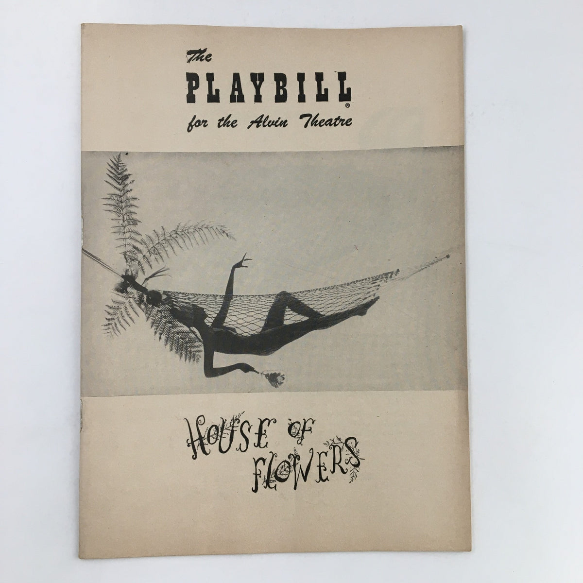 Front cover of the 1955 Playbill for the Alvin Theatre featuring Truman Capote's musical 'House of Flowers', showcasing an artistic illustration.
