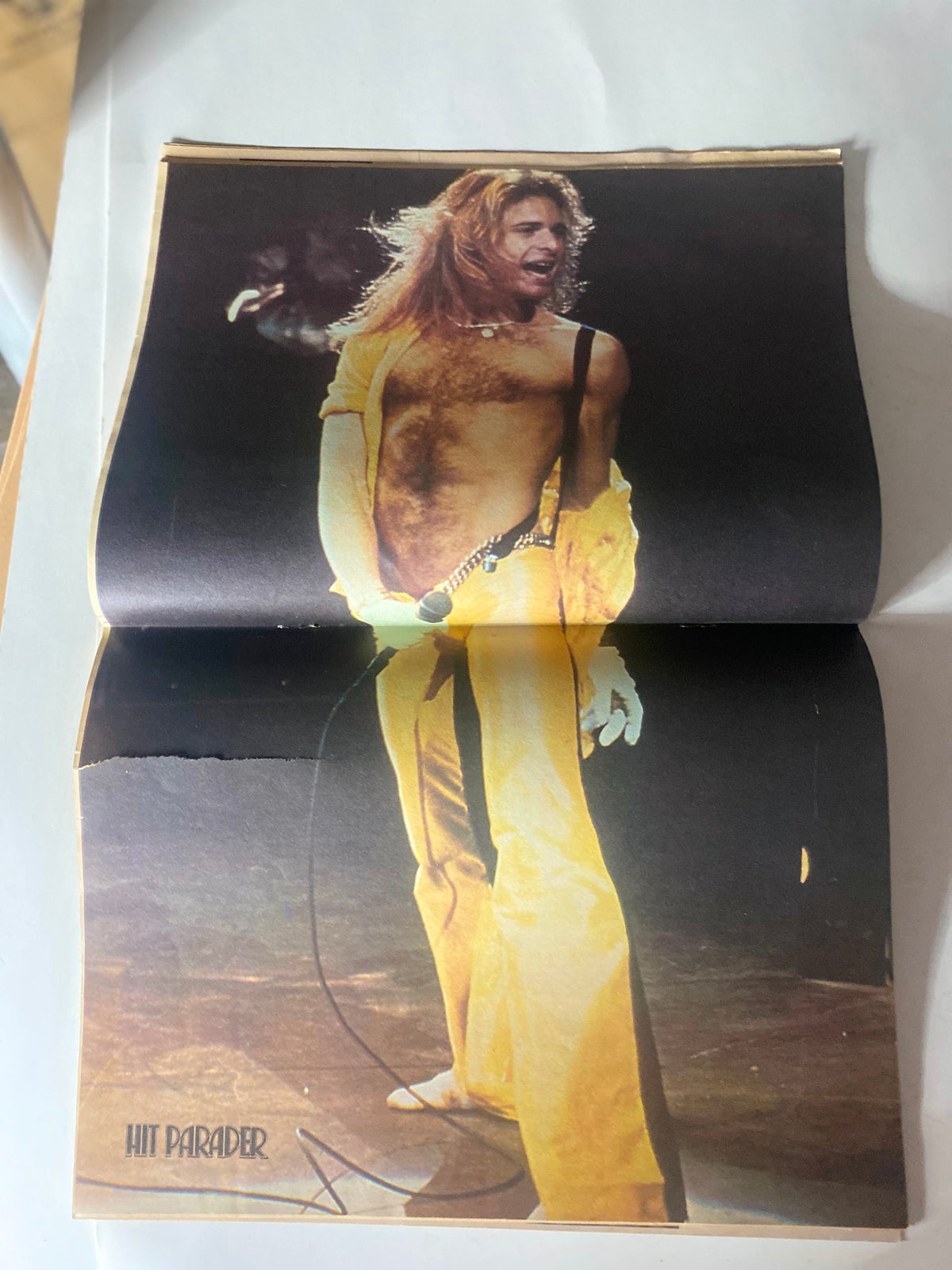Vintage Hit Parader Magazine October 1980 featuring a dynamic performance image of an artist wearing a yellow outfit and singing passionately on stage.