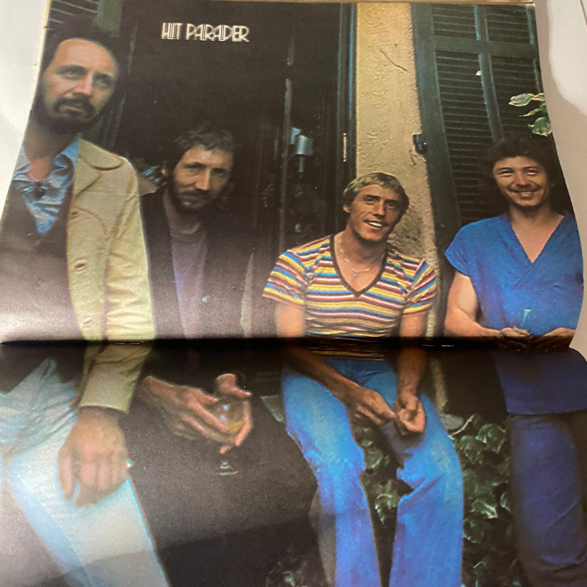Centerfold image featuring members of The Who and Ron Wood featured in VTG Hit Parader Magazine October 1979, capturing a candid moment.