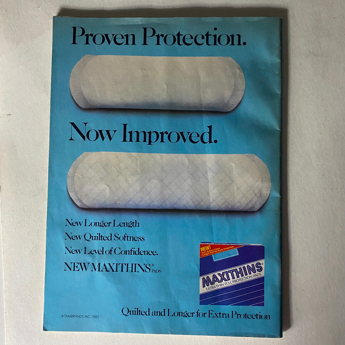 Advertising page from January 1986 issue of Tiger Beat magazine for Maxithins pads, promoting comfort and protection.