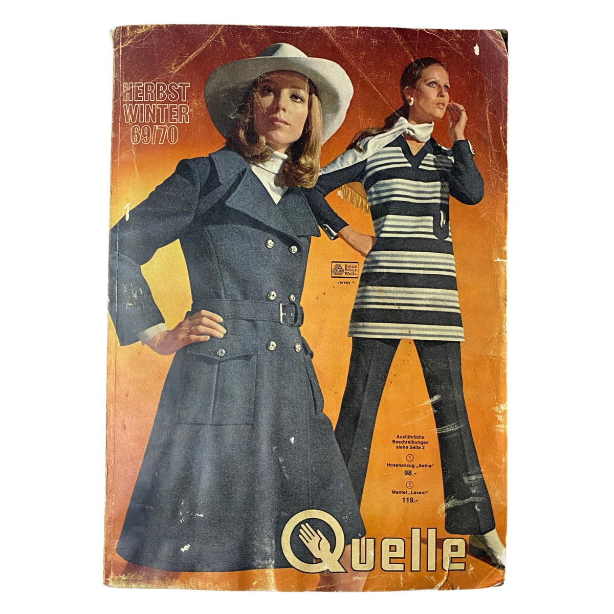 1969 - 1970 Quelle Winter Catalog cover featuring a model in a stylish navy double-breasted coat and a wide-brimmed hat, alongside a striped outfit.