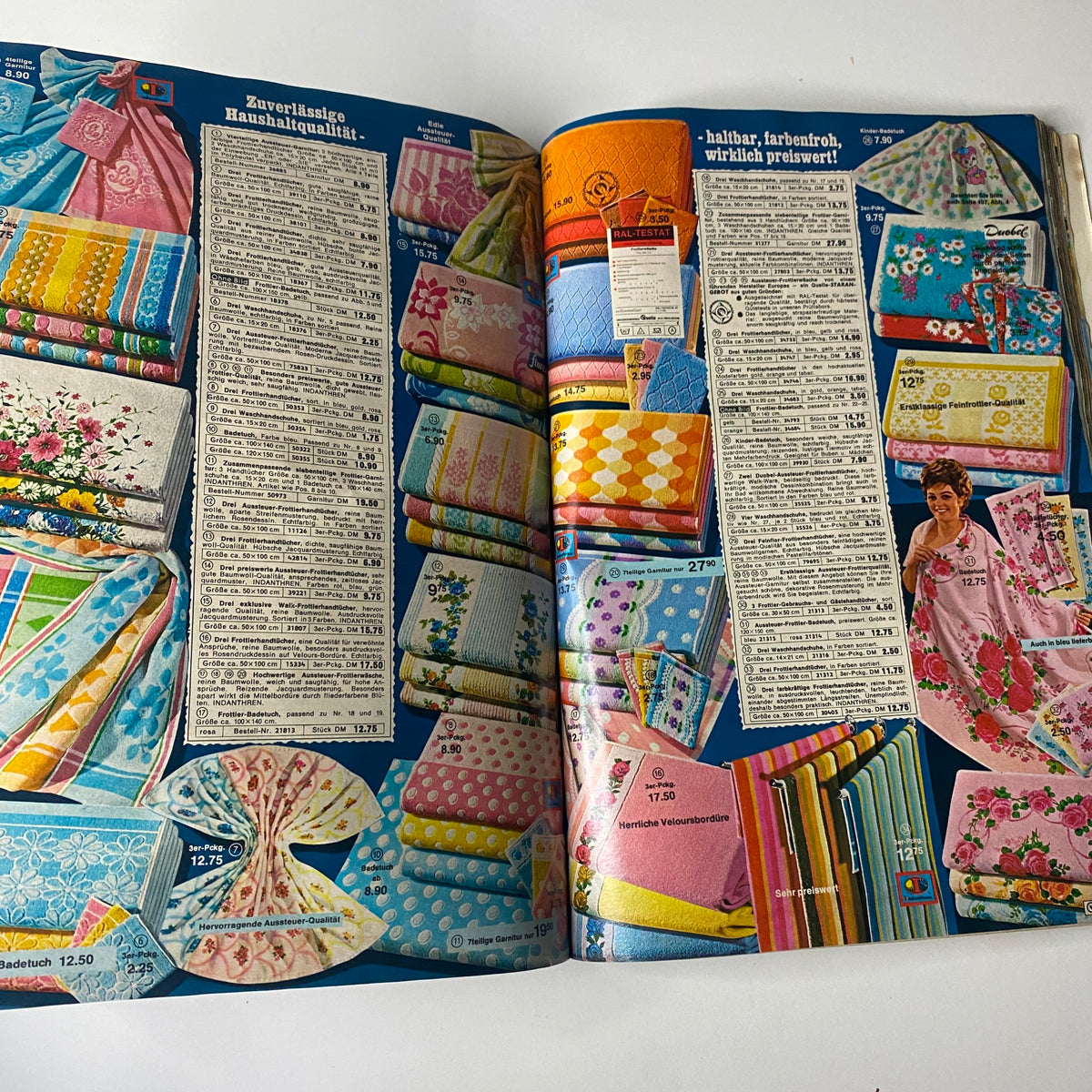 1969 - 1970 Quelle Winter Catalog displaying a colorful array of household textiles including towels and tablecloths with floral patterns, emphasizing the bold design trends of the late 1960s.