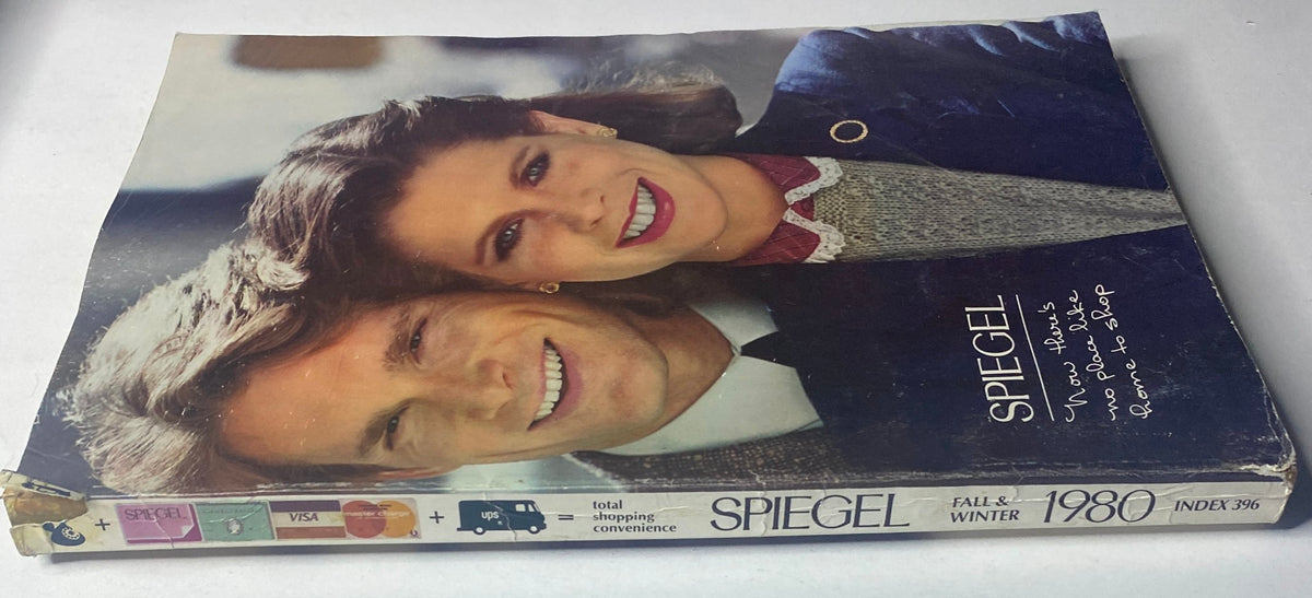 Side view of the 1980 Spiegel Fall and Winter Catalog showcasing the cover with a couple and promotional taglines for the collection.