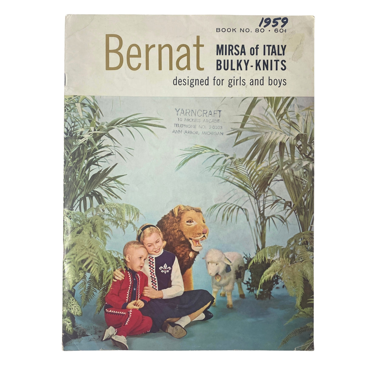 Cover of the 1959 No. 80 Bernat Mirsa of Italy Bulky-Knits Catalog featuring children and a life-sized lion and sheep prop.