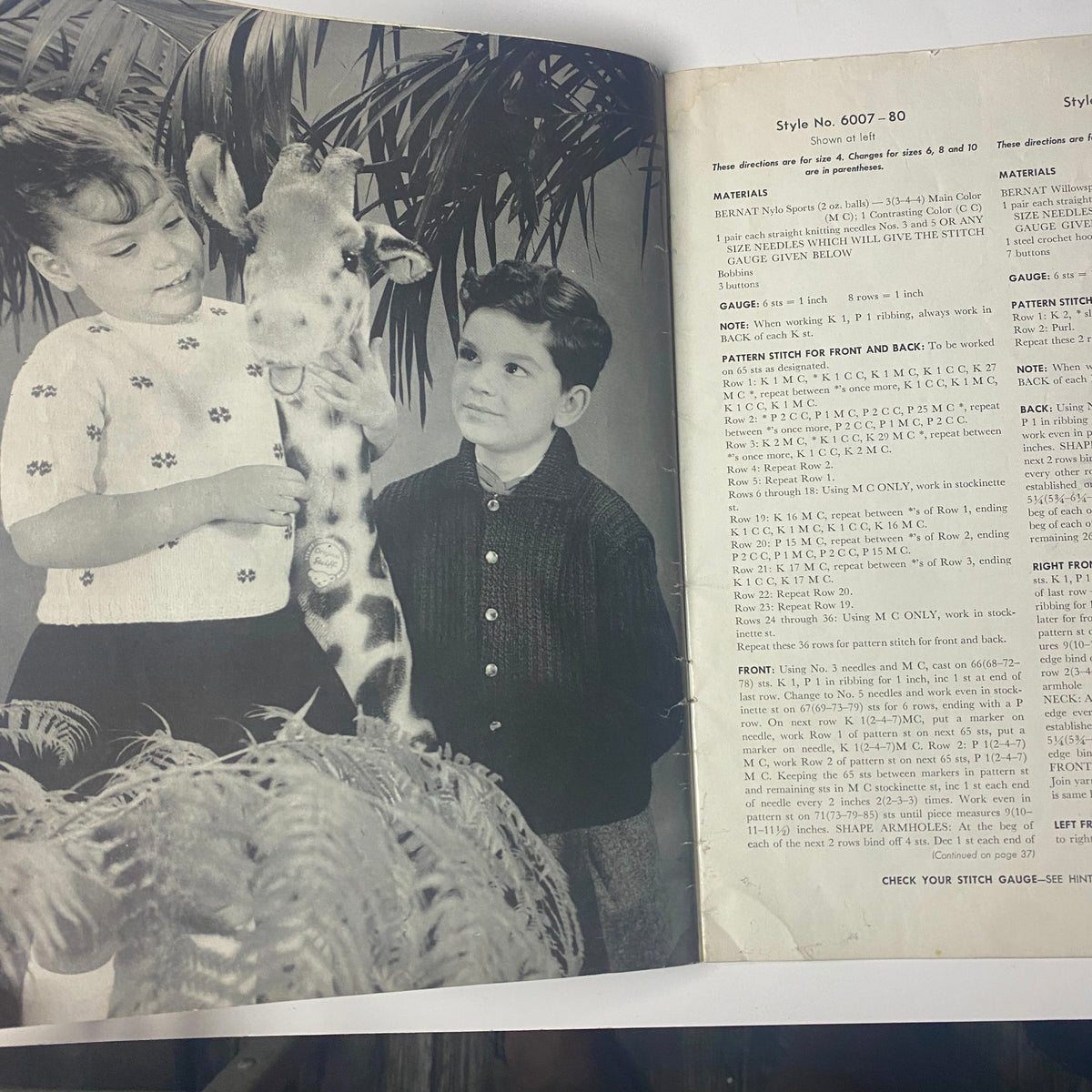 1959 No. 80 Bernat Mirsa of Italy Bulky-Knits Catalog showcasing a children's sweater design with kids alongside a giraffe toy.