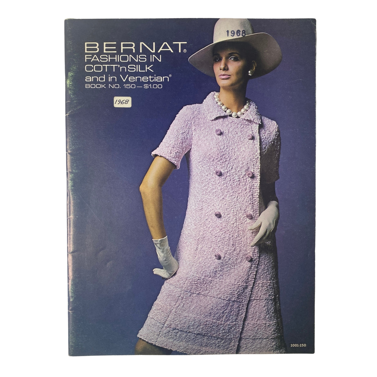 1968 No. 150 Bernat Catalog cover featuring a stylish model in a pink, double-breasted coat dress and wide-brimmed hat, showcasing vintage fashion design.