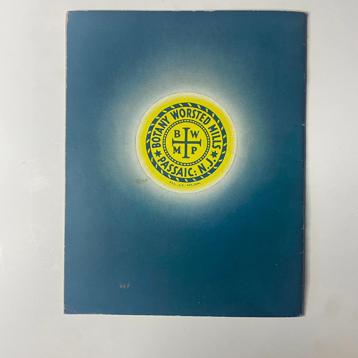 Cover of 1945 Vol. 8 Knitted Perennials by Botany Catalog featuring the Botany Worsted Mills logo in vibrant yellow on a blue background.