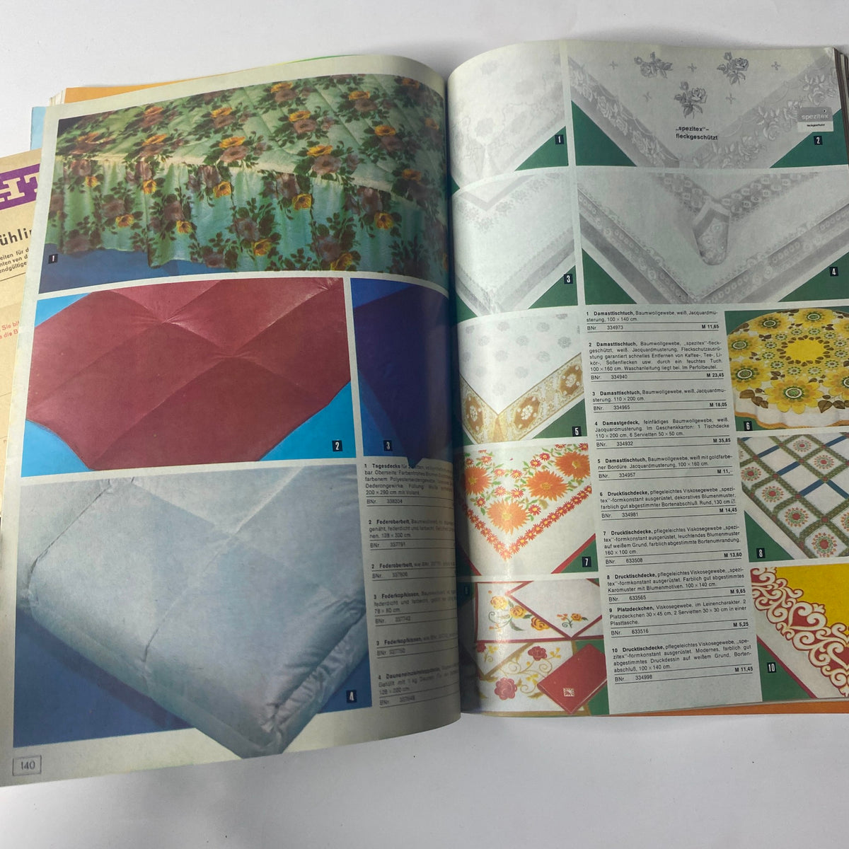 1975 Konsument Summer Catalog presenting an assortment of decorative table linens, including tablecloths and napkins with colorful patterns.