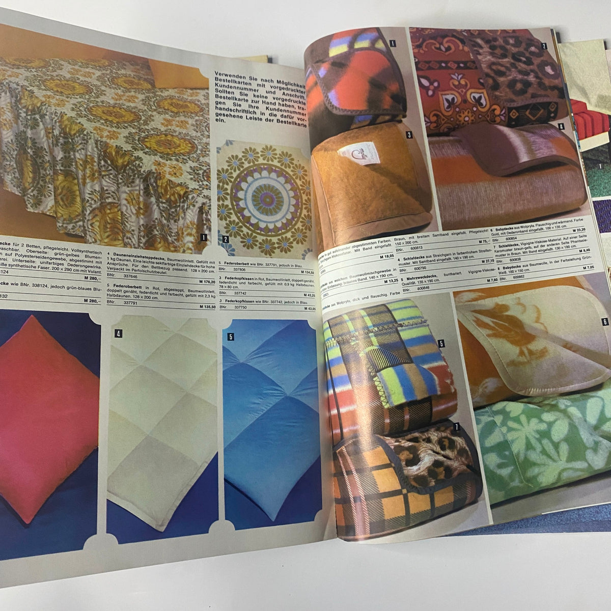 1974 Konsument Summer Catalog presenting a variety of textile designs featuring colorful tablecloths, decorative table coverings, and cozy blankets, illustrating vibrant patterns suitable for home decor.