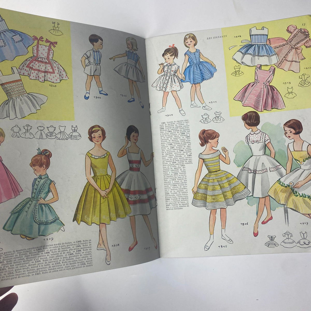 Another interior page of the 1959 No. 55 Les Enfants Elegances Pratiques Catalog showcasing colorful illustrations of children's dresses, highlighting playful and elegant designs.