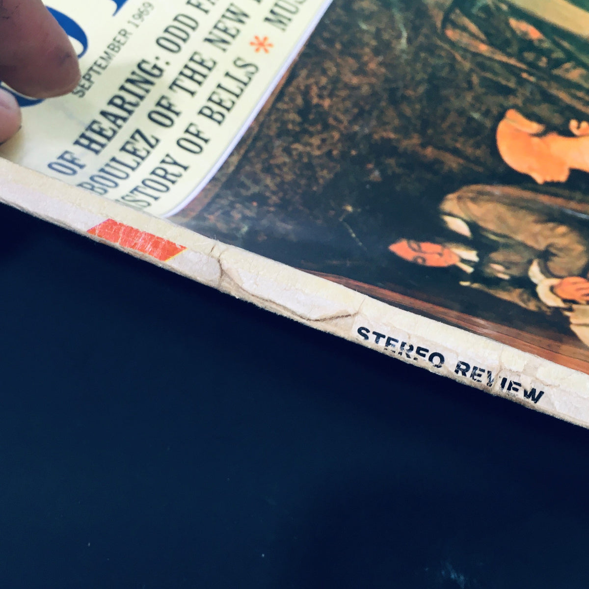 Close-up view of the spine of VTG Stereo Review Magazine September 1969, detailing its vintage condition and title.