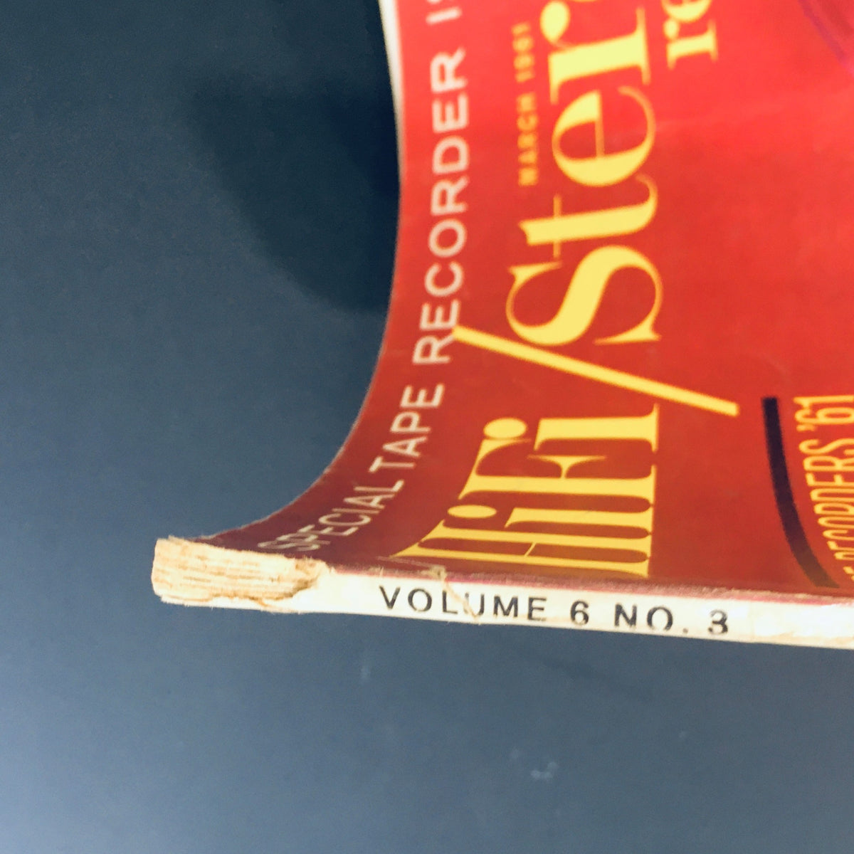 Side view of VTG Stereo Review Magazine March 1961 showing the spine and volume information with slight wear, a notable piece for vintage magazine enthusiasts.