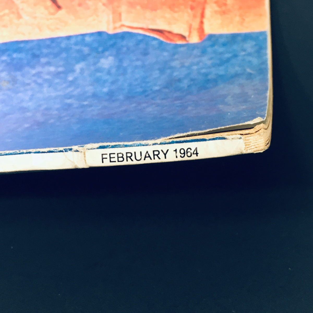 Close-up of the spine of HiFi Stereo Review Magazine February 1964 showing publication date, part of the vintage magazine by J.S. Dwight, ideal for collectors and audiophiles.