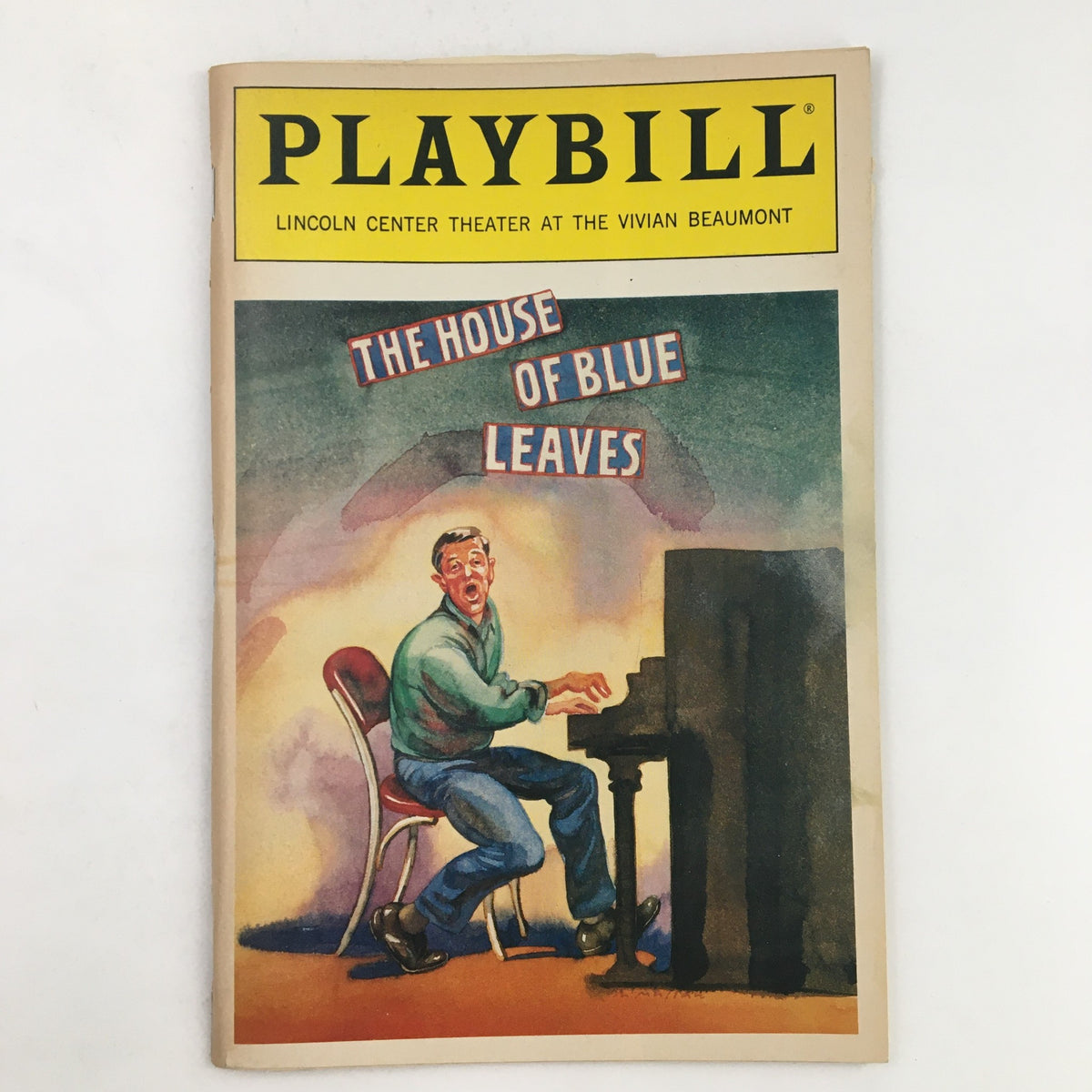 1986 Playbill Lincoln Center Theater The House of Blue Leaves by John Guare featuring a vibrant illustration of a man playing piano, capturing the essence of live theater.