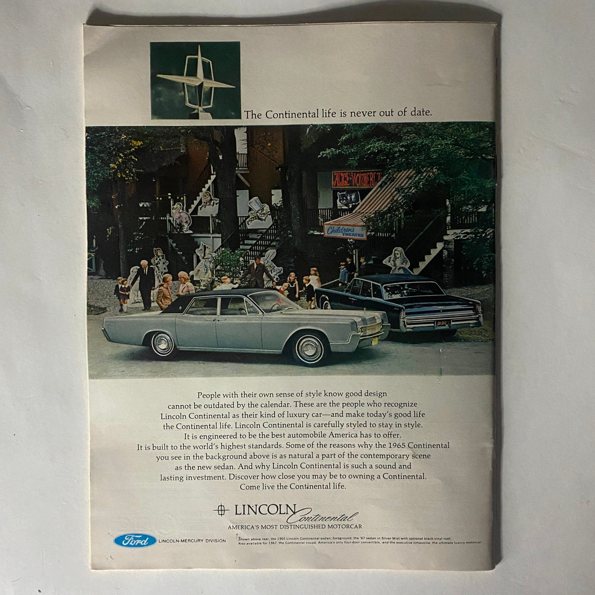 Vintage advertisement for the Lincoln Continental featuring a stylish car and elegantly dressed people, highlighting the tagline 'The Continental life is never out of date.' This image is from the VTG The Reporter Magazine May 4, 1967, showcasing luxury and sophistication.