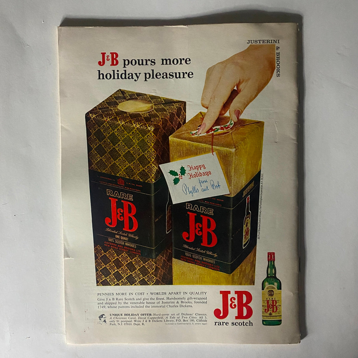 Vintage advertisement for J&B Rare Scotch featured in VTG The Reporter Magazine, November 17, 1966, showcasing holiday packaging and greeting.