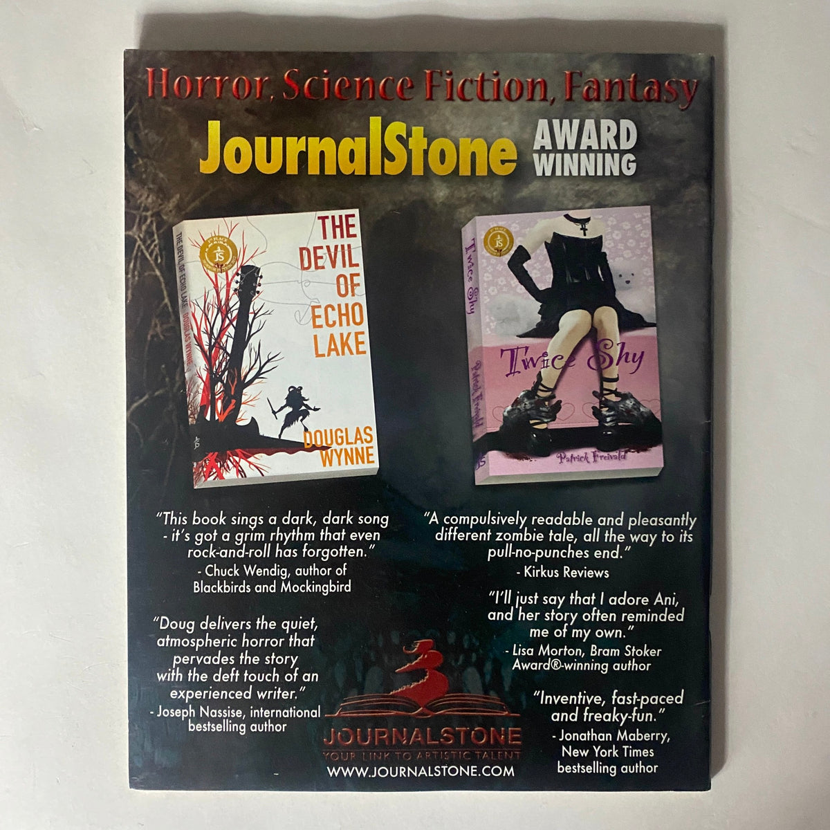 Cover of Cemetery Dance Magazine December 2012 #68 featuring books by Douglas Wynne. The image highlights the notable horror titles 'The Devil of Echo Lake' and 'Twice Shy', showcasing their dark themes and award-winning accolades.