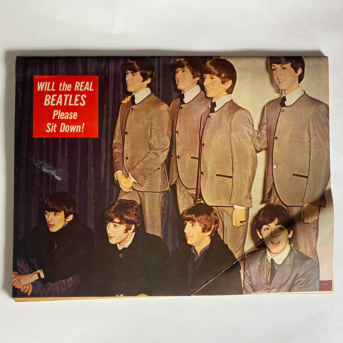 Vintage 1964 Beatles Movie Book showcasing group photo of The Beatles dressed in matching suits with a humorous caption about their identity.