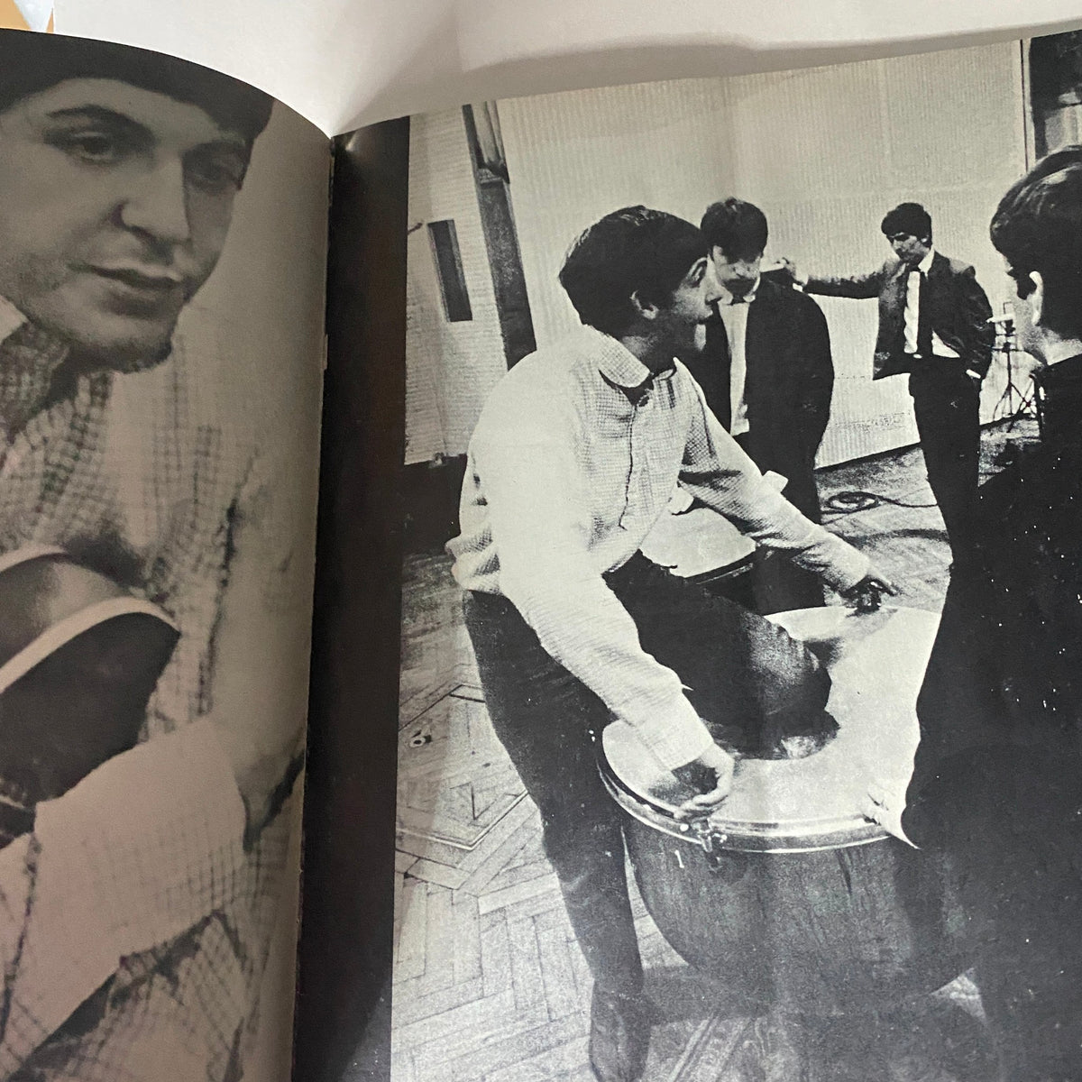 Vintage 1964 The Beatles by Norman Parkinson showing Paul McCartney and the band members engaged in a musical rehearsal, perfect for framing as a collectible piece of music history.