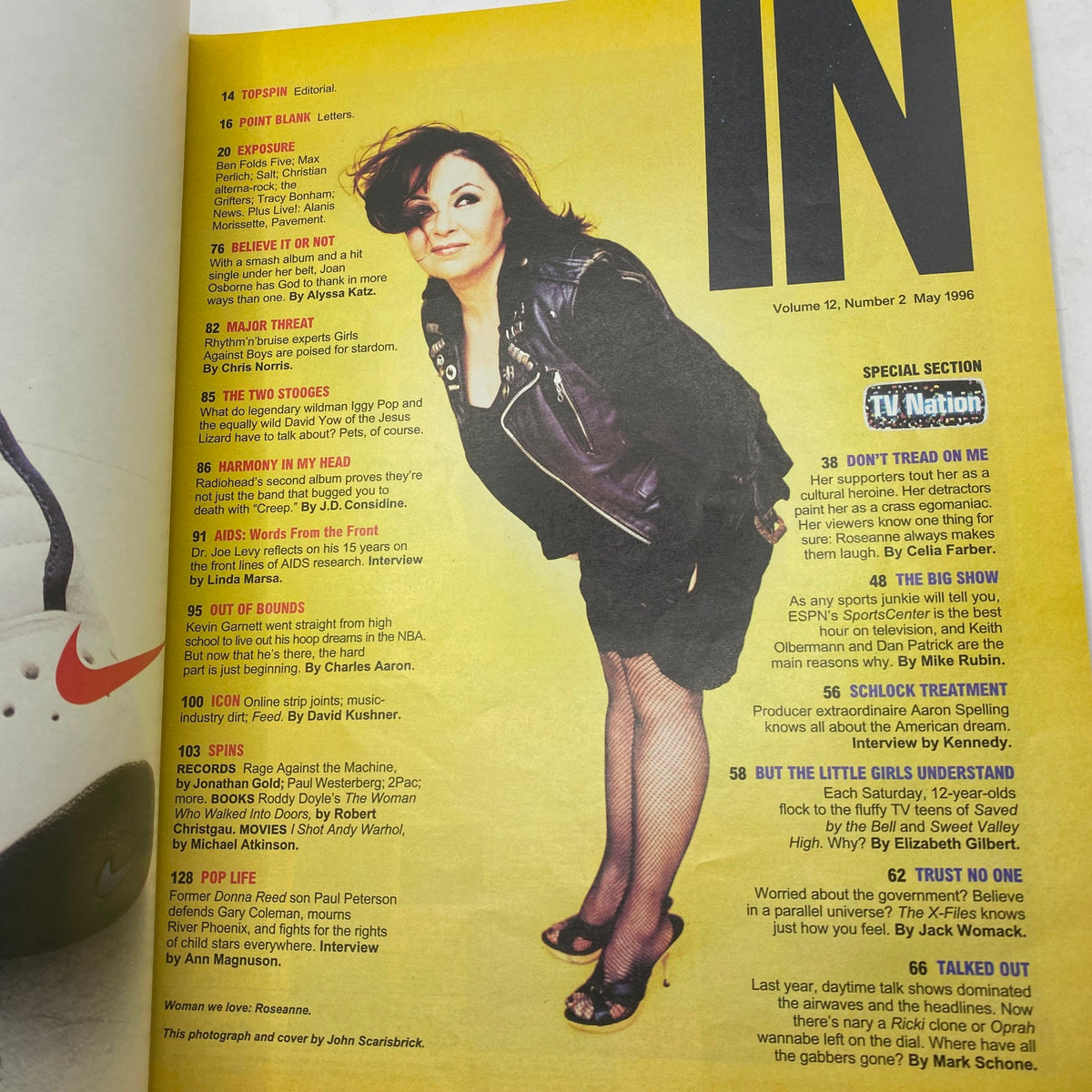 Spin Magazine May 1996 Vol 12 No 2 featuring Roseanne Barr, showcasing her in a leather jacket on the cover with a bold yellow background, highlighting her influence in American comedy.