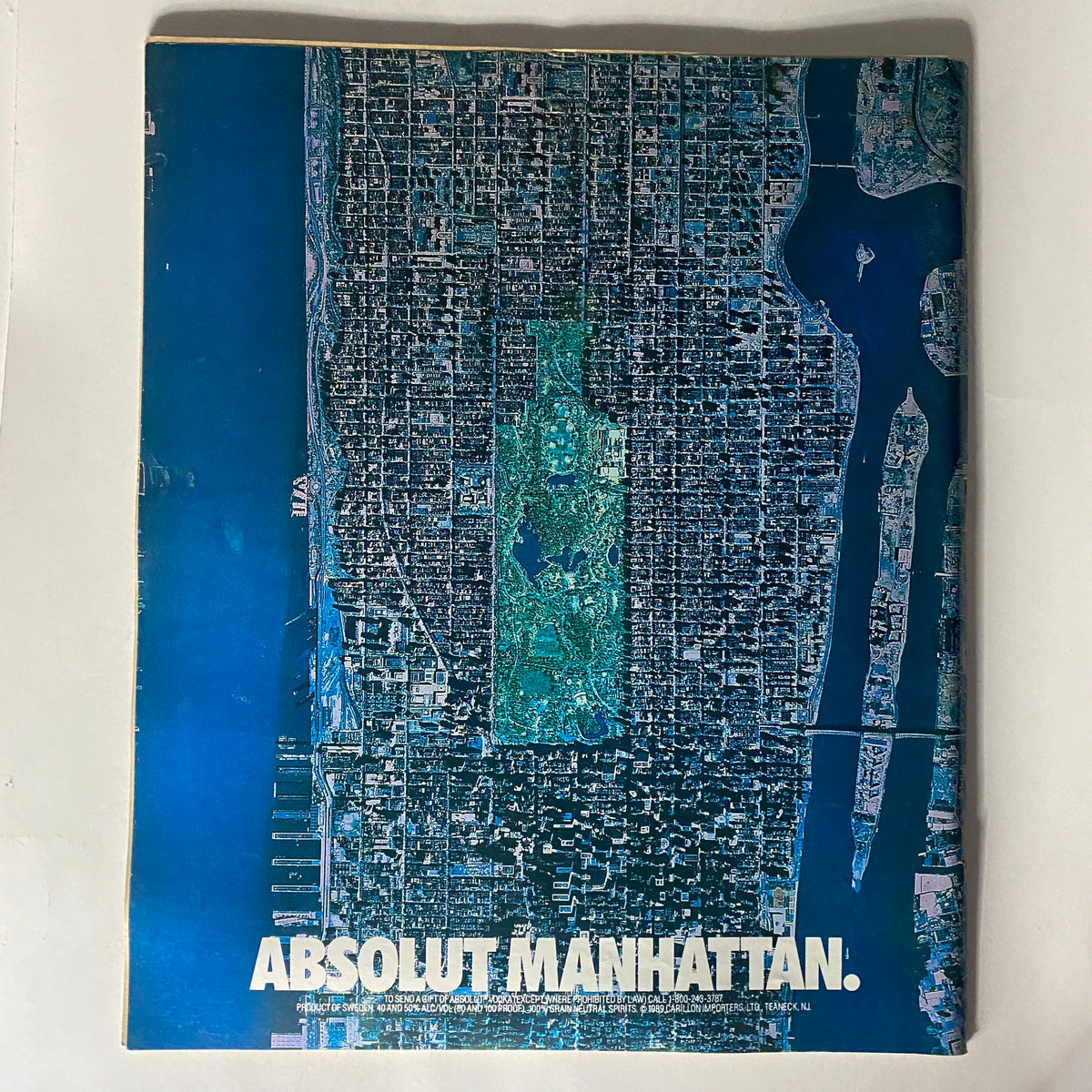 Cover of Spin Magazine January 1990 Vol 5 No. 10 featuring a striking graphic design with the title 'ABSOLUT MANHATTAN' and an aerial view of Manhattan.