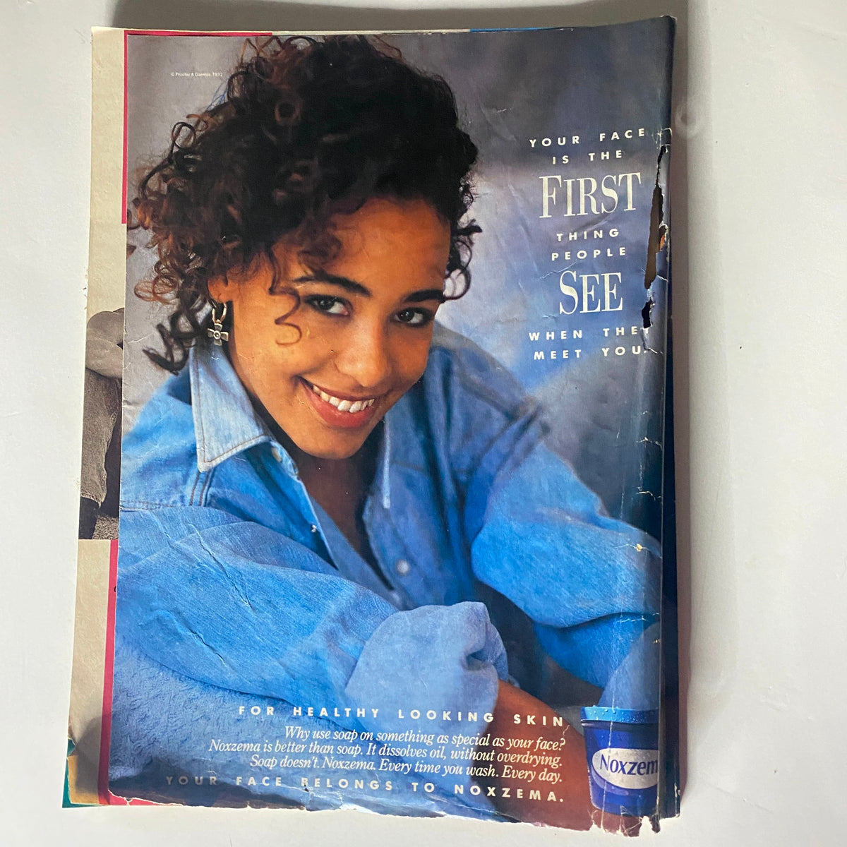 An advertisement from Teen Magazine October 1992 promoting Noxzema skincare products, featuring a smiling model in a denim jacket.