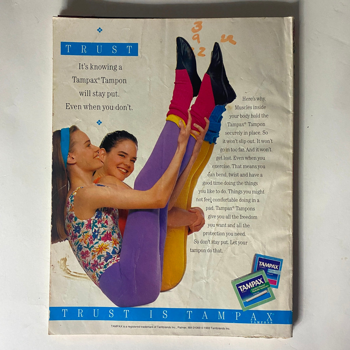 Vintage Tampax advertisement from 1993 included in Teen Magazine June 1993, featuring two models in colorful attire discussing tampon reliability.