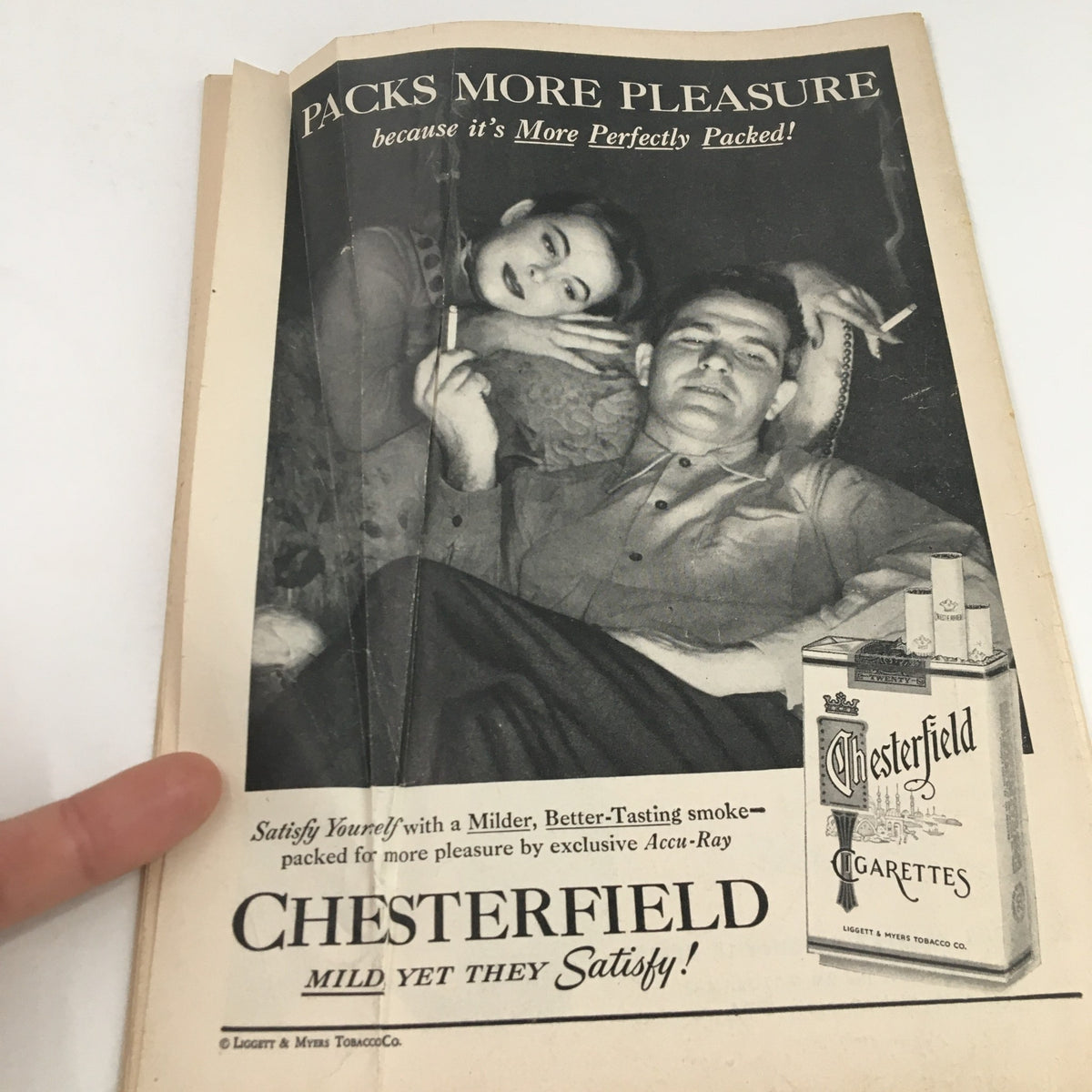 Advertisement from the 1956 Playbill for Chesterfield cigarettes, illustrating a nostalgic marketing design from the era.