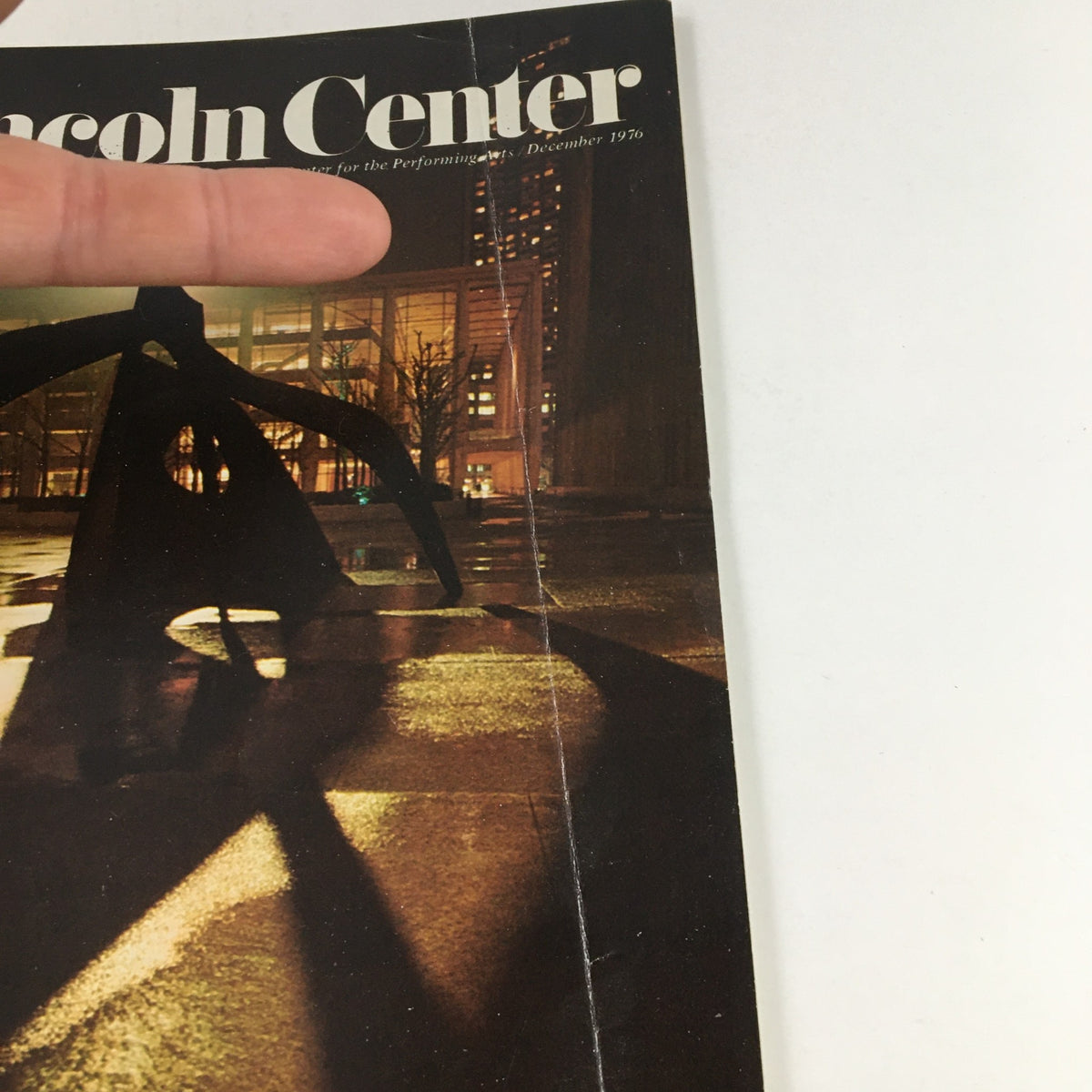 Cover image of the 1976 Stagebill Lincoln Center Theatre presenting Mozart by Marionette, featuring a shadowy sculpture and cityscape at night.
