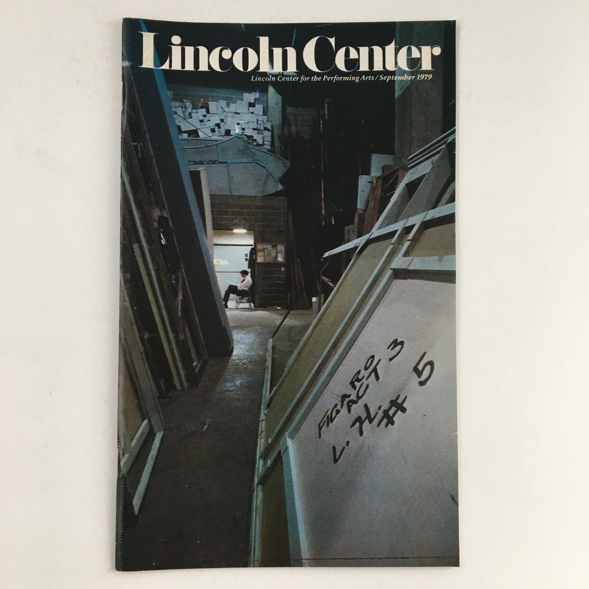 1979 Stagebill for Lincoln Center Performing Arts featuring the program for Figaro Act 3. The cover shows a backstage view with wooden frames and dim lighting, indicative of theatrical settings.