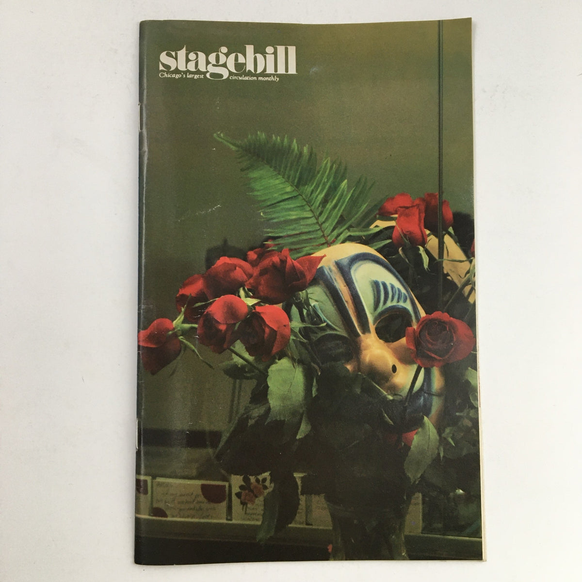 Cover of the 1988 Stagebill Lincoln Center Performing Arts Present Curtain Calls by L. Lazare, featuring a theatrical mask surrounded by roses, symbolizing the vibrant arts scene.