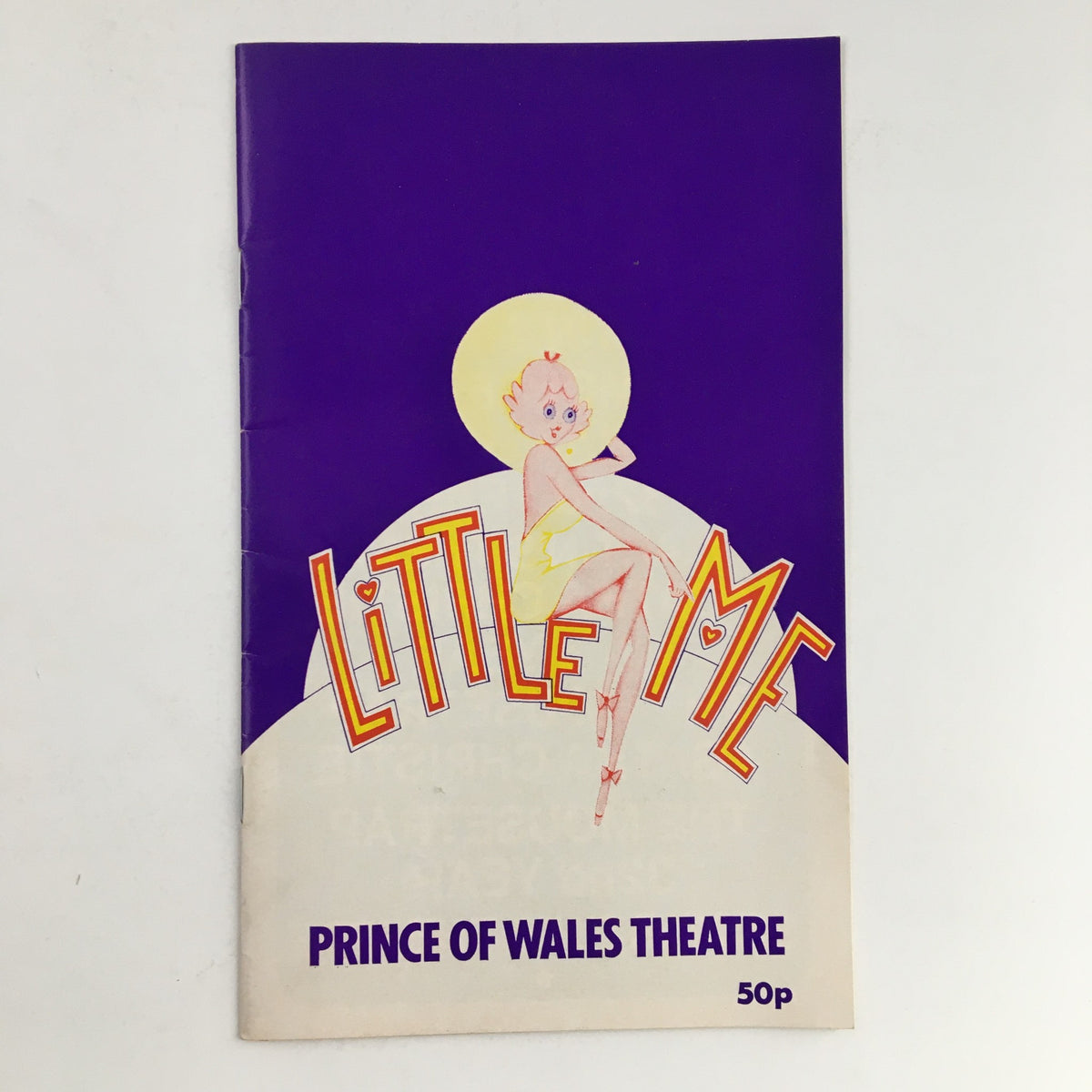 Program cover for 'Little Me' presented by the Prince of Wales Theatre in 1984, featuring the show's title in vibrant colors and a cartoon character illustration.