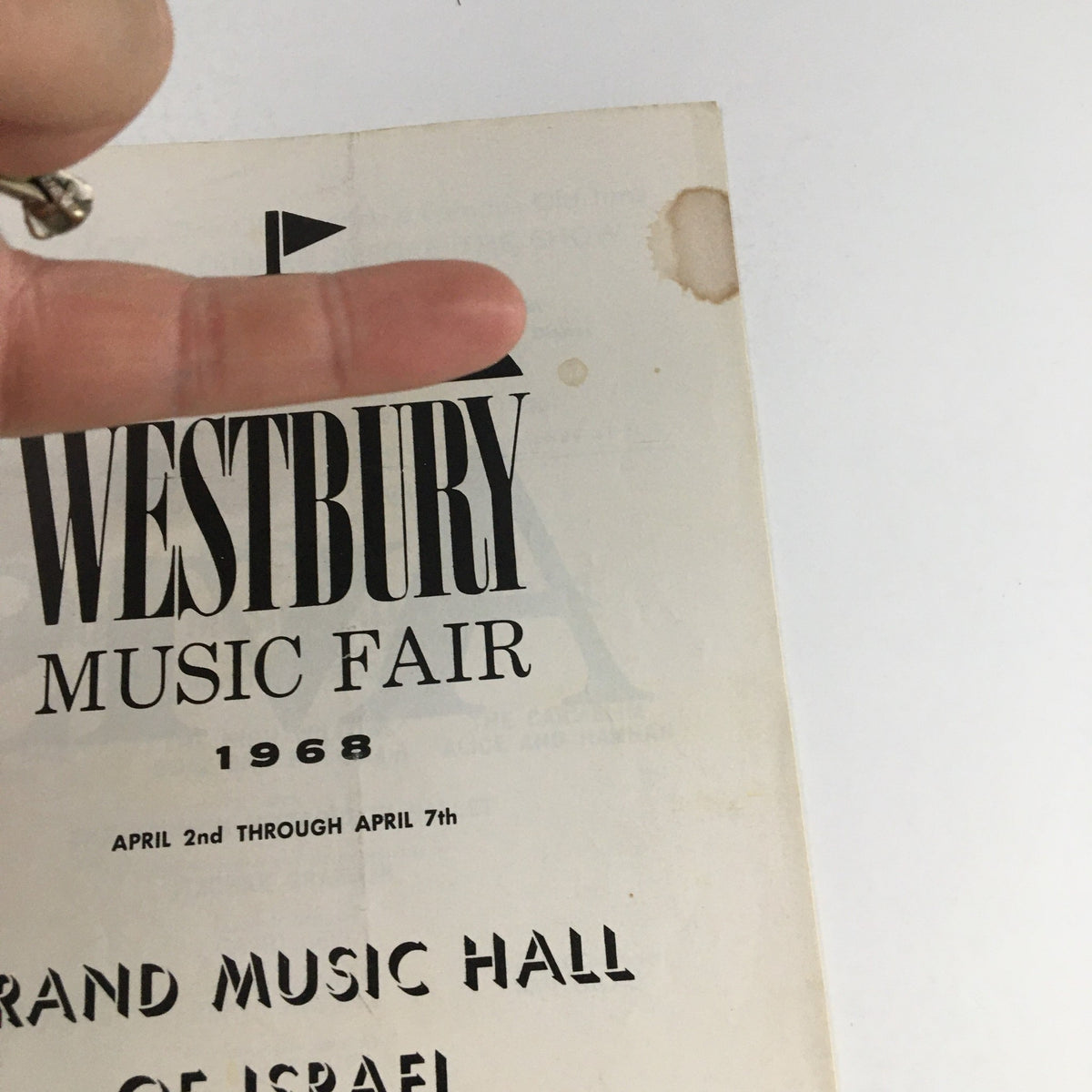Close-up view of the 1968 Westbury Music Fair Grand Musical Hall of Israel showing the title and dates, highlighting minor wear from age.