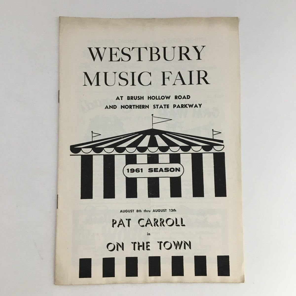 1961 Season Westbury Music Fair program cover featuring Pat Carroll in On The Town, showcasing a vintage design with a striped tent motif and details of the performance.