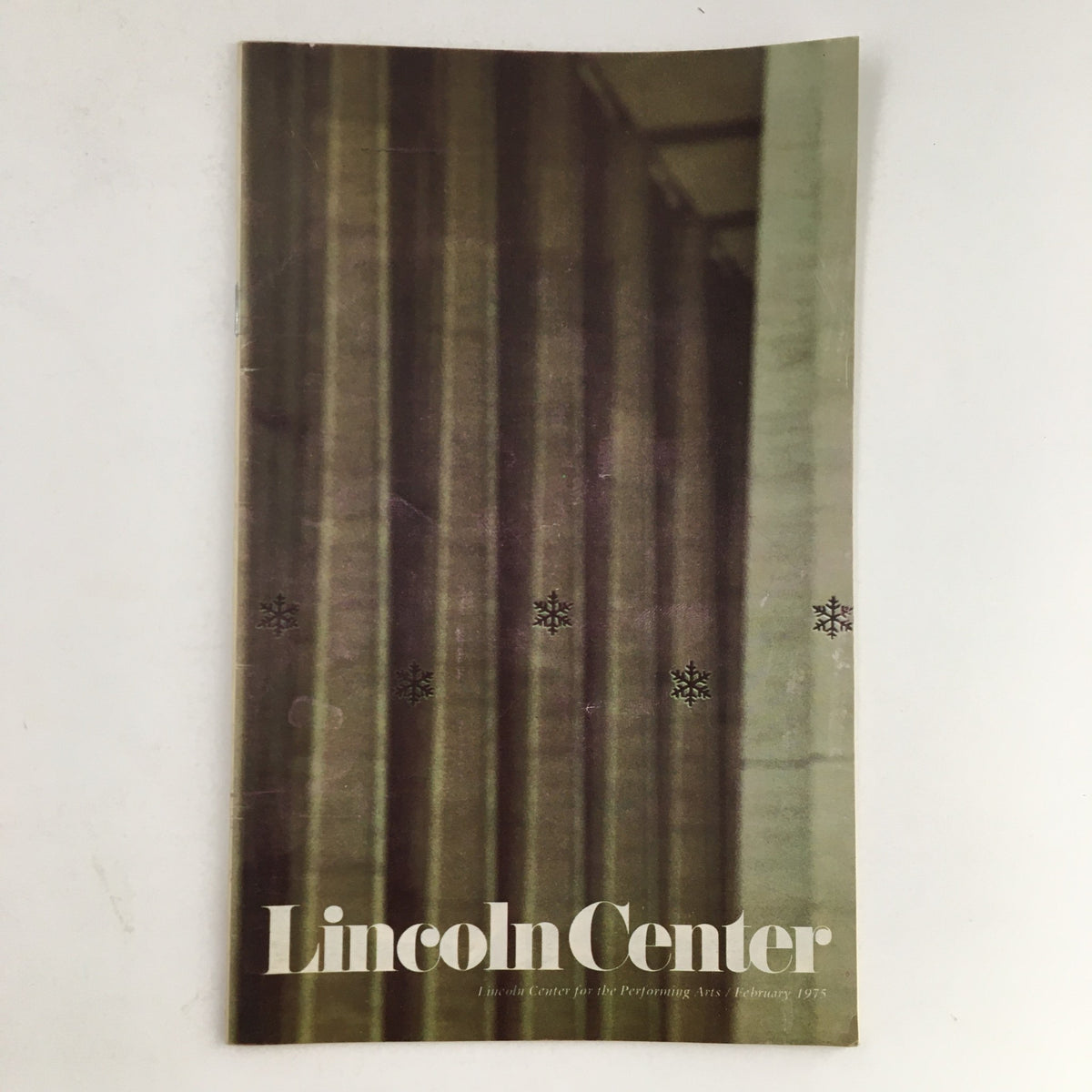 Cover of the 1975 Stagebill from Lincoln Center for the Performing Arts featuring a minimalist design and the title 'Lincoln Center' in bold typography. This issue presents Frank Schubert.