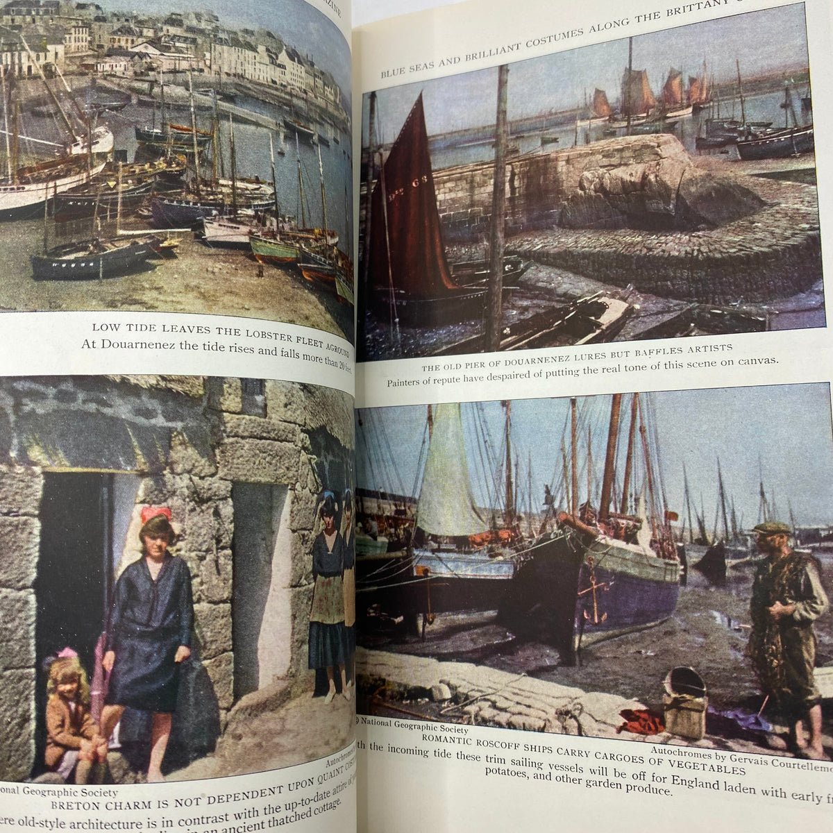 Image from VTG The National Geographic Magazine August 1929 featuring the coastal scene of Douarnenez, France with boats and local figures, showcasing the vibrant colors and historical context of the Santa Fe Trail edition.
