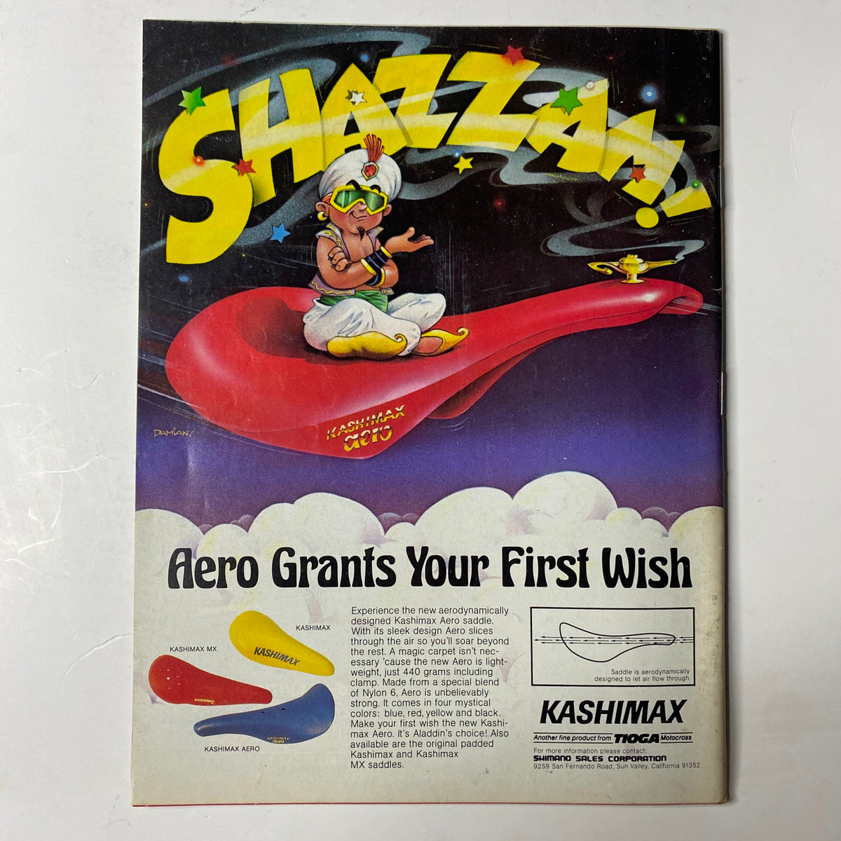 BMX Action Magazine March 1983 featuring King Edward on the cover with the tagline 'SHAZZAM! Aero Grants Your First Wish'. The image showcases an advertisement for Kashimax pedals with a whimsical character, emphasizing the retro BMX culture from the early 1980s.