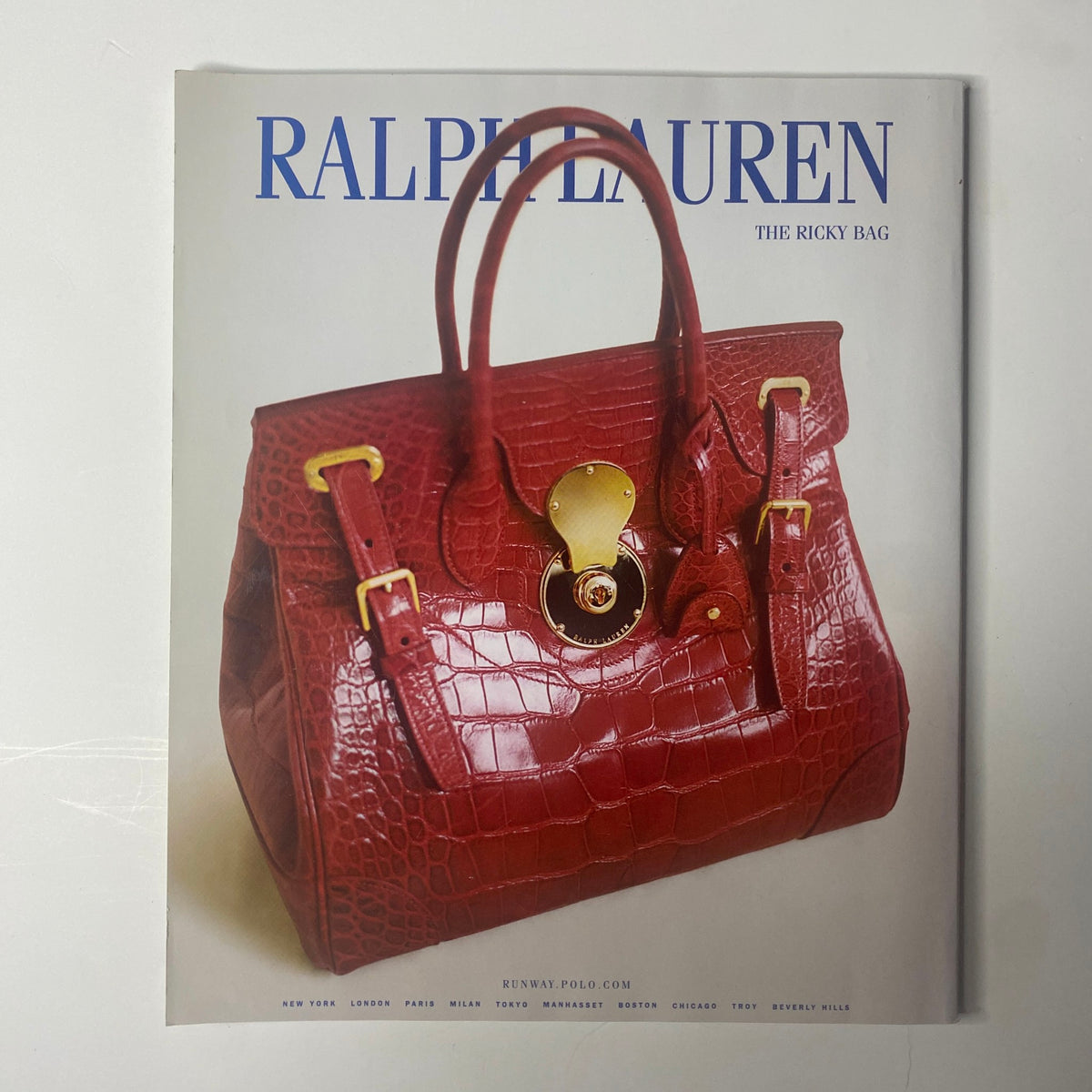 2006 Elle Accessories Spring Catalog showcasing a Ralph Lauren advertisement featuring the iconic Ricky Bag in a striking red crocodile print, representing luxury fashion.