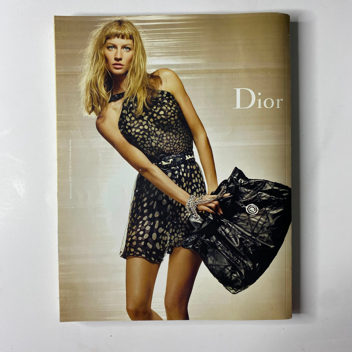 2009 First Love Spring and Summer Catalog cover displaying an elegant model in a polka dot Dior dress, evoking high fashion aesthetics of the 2000s.