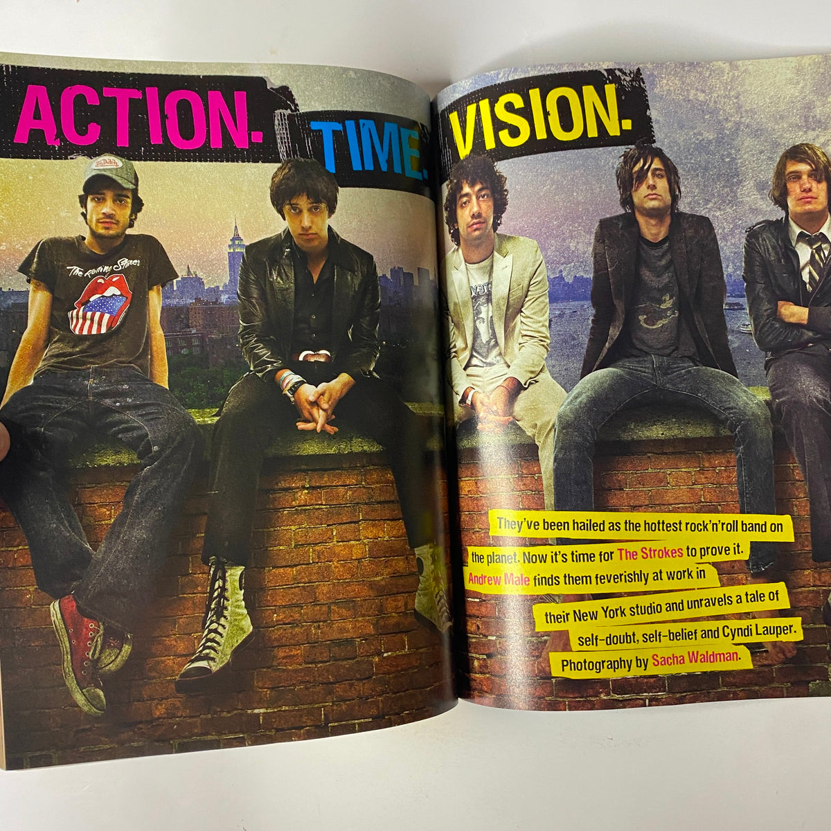 Feature article in Mojo Music Magazine September 2003 focused on The Strokes, discussing their journey in rock music alongside an urban backdrop.