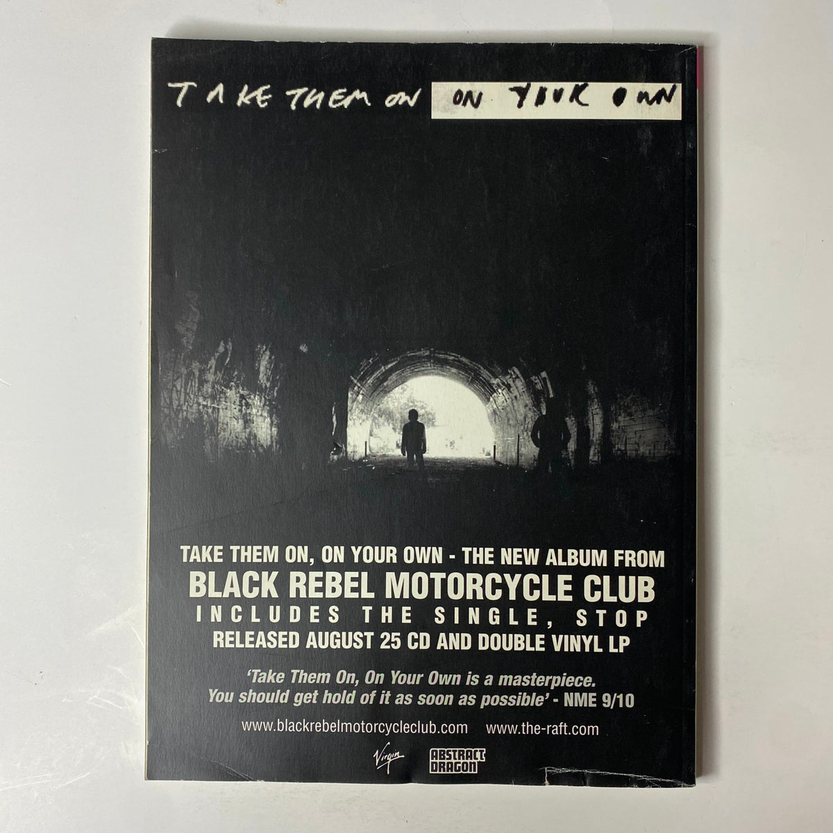 Promotional image for the album 'Take Them On, On Your Own' by Black Rebel Motorcycle Club, showcasing the album's release details including the single 'Stop', with the original Mojo Music Magazine title 'Mojo Music Magazine September 2003 The Strokes No CD Included No Label' in the background.